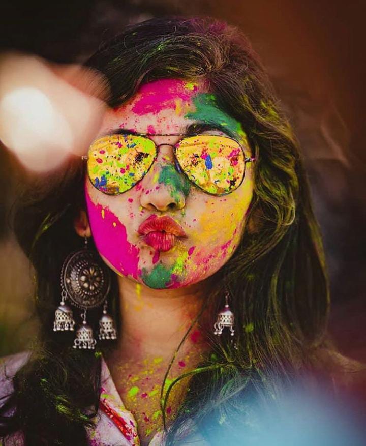 Woman in white long sleeve shirt with purple yellow and blue powder on her  face photo – Free Holi celebration Image on Unsplash